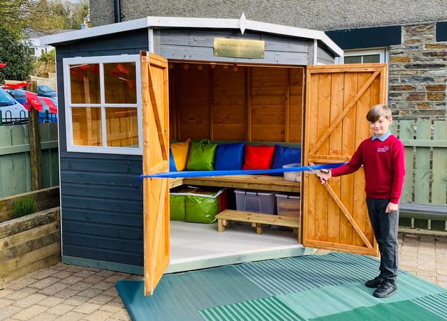 School's touching tribute to 'cherished' volunteer with reading shed